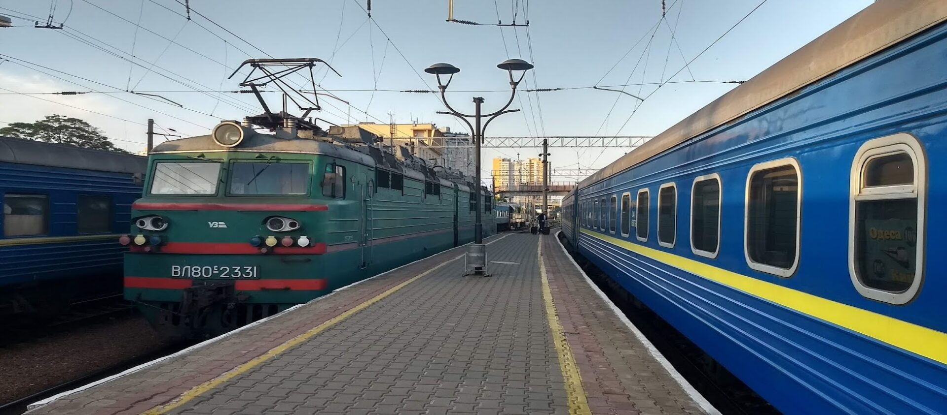 Two beautiful colored train. The left train has the same colores as the ukrainian flag